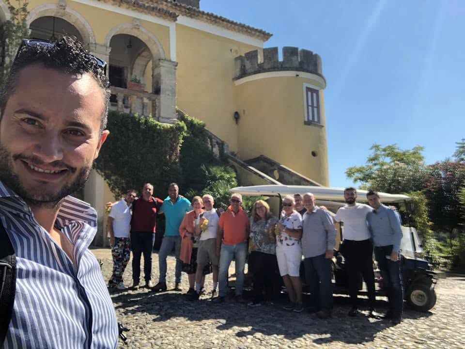 A Vita Calabra Tours group gathered in front of a historic Calabrian villa during a private heritage tour
